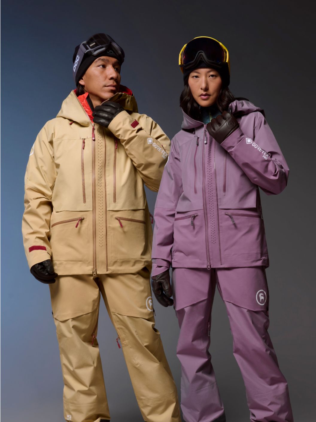 A man and woman wearing Cardiac GORE-TEX PRO snow kits.